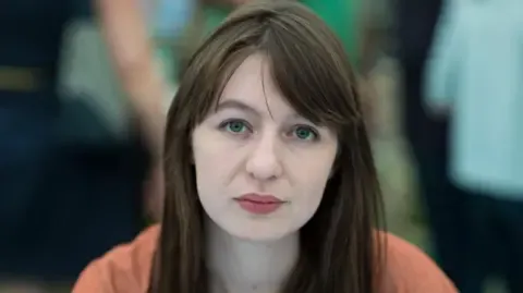 Irish author Sally Rooney states she cannot travel to the UK over legal concerns